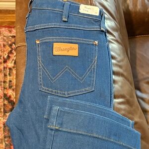 Women’s Wranglers over exaggerated boot, cut trousers